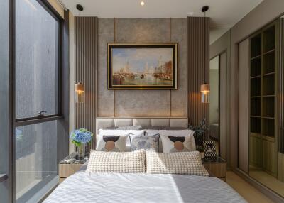 Modern bedroom with large windows, decorative wall art, and stylish furnishings