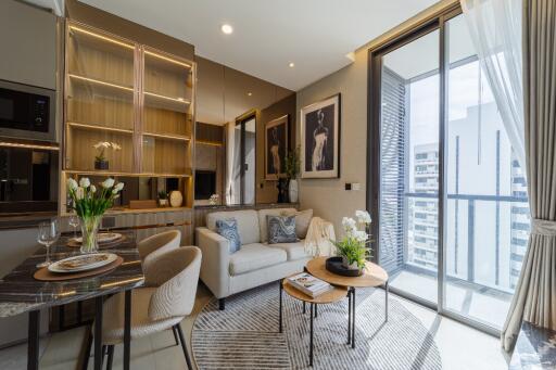 Modern living room with dining area and large windows