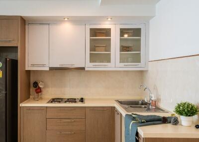 Modern kitchen with wooden cabinets and light countertops