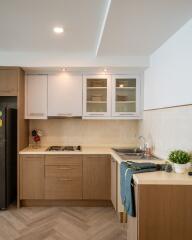 Modern kitchen with wooden cabinets and light countertops