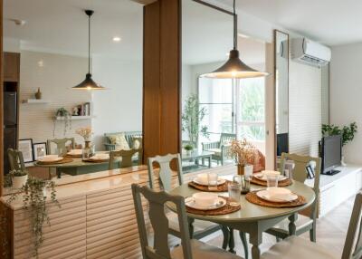 Modern dining area with round table and chairs