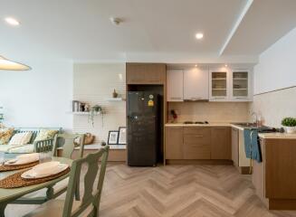 Modern kitchen and dining area with wooden cabinets