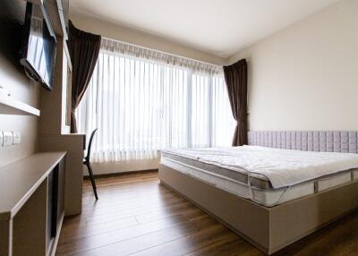 modern bedroom with large windows and natural light