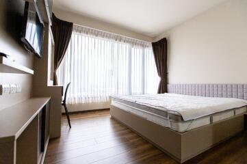 modern bedroom with large windows and natural light