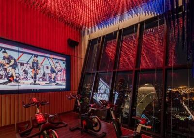 Indoor cycling studio with panoramic city view