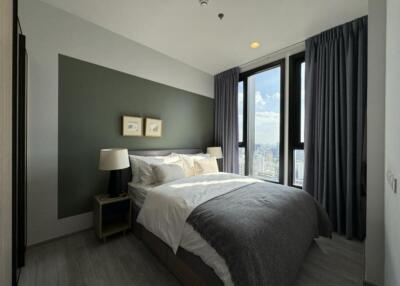 Modern bedroom with large windows and contemporary decor