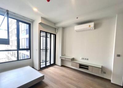 Modern living room with large windows and a balcony