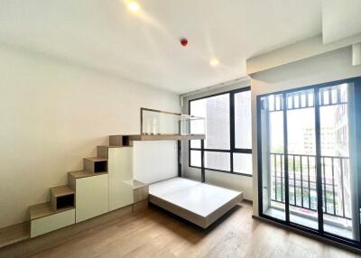 modern living area with large windows and mezzanine bed