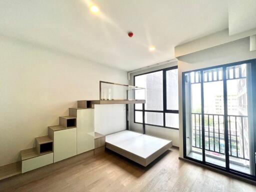 modern living area with large windows and mezzanine bed