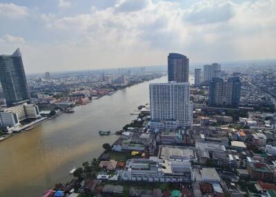 Aerial view of the city with river and high-rise buildings