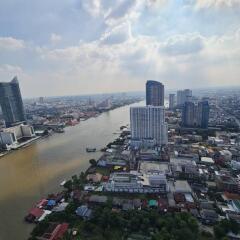 Aerial view of the city with river and high-rise buildings