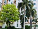 Exterior view of a multi-story residential building with landscaped garden