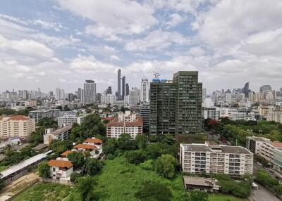 High-rise city buildings and green spaces