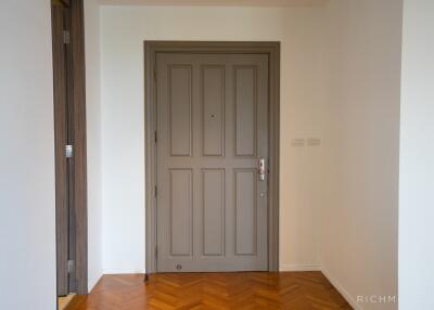 Main entrance door with wooden flooring