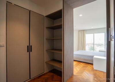 Bedroom with closet and built-in shelves