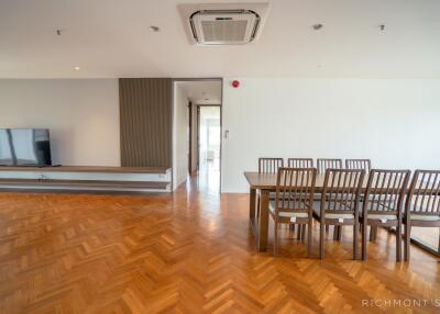 Spacious modern living room and dining area with wooden flooring