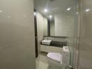 Modern bathroom with white tiles and fixtures