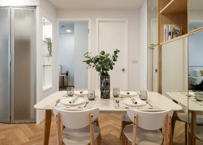 Modern dining area with a table set for four and elegant decor