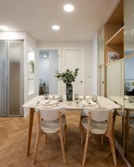 Modern dining area with a table set for four and elegant decor