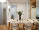 Modern dining area with a table set for four and elegant decor