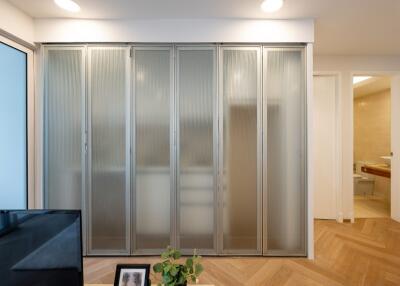 Living area with frosted glass sliding doors