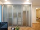 Living area with frosted glass sliding doors