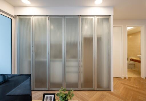 Living area with frosted glass sliding doors