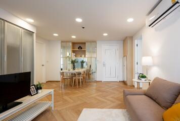 Spacious living room with modern decor and dining area