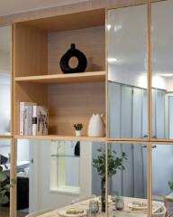 Decorative shelving with books and ornaments in modern living area