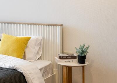 A cozy bedroom with a side table