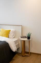 A cozy bedroom with a side table