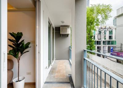 Spacious modern balcony with railing and plant