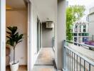 Spacious modern balcony with railing and plant