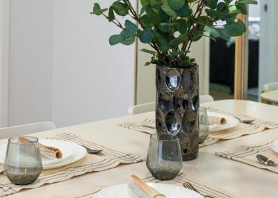 Dining table with place settings and decorative centerpiece