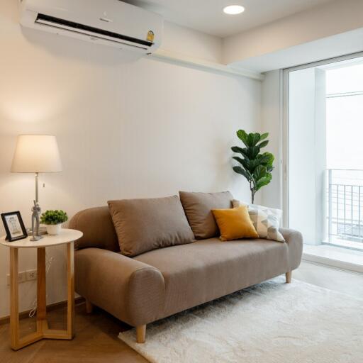 cozy living room with sofa and air conditioning