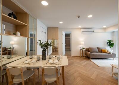 Modern living room with dining area and wooden flooring