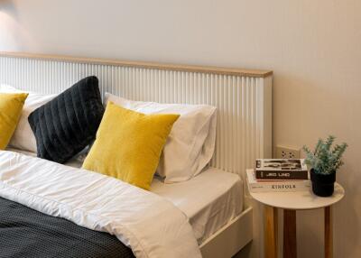 Cozy bedroom with gray and yellow cushions