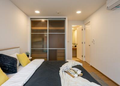 Modern bedroom with sliding closet doors and contemporary decor