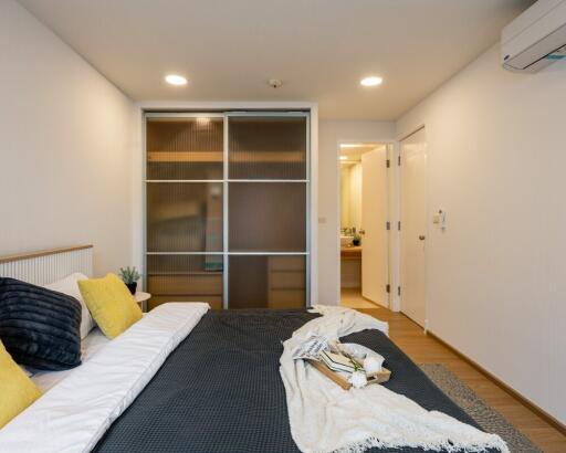 Modern bedroom with sliding closet doors and contemporary decor