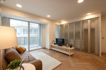 Modern living room with large windows and sliding glass doors