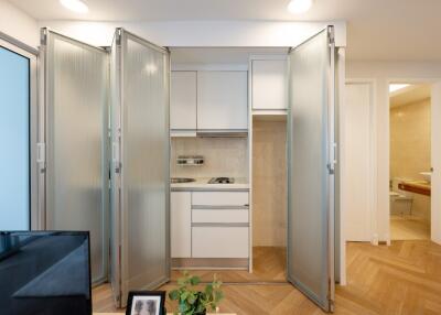 Small kitchen with frosted glass folding doors