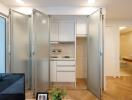 Small kitchen with frosted glass folding doors