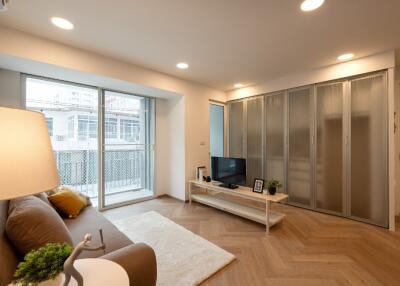 modern living room with large window and sliding doors