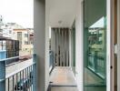 Covered balcony with railing and glass door