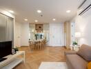 Modern open-plan living and dining room with wood flooring