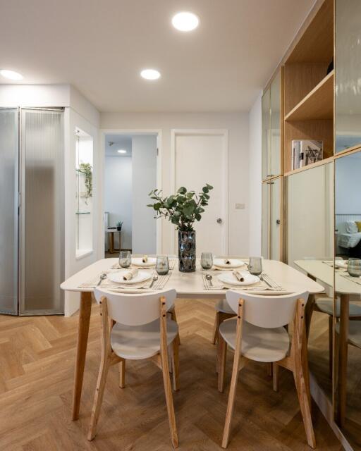 Modern dining area with a table set for four