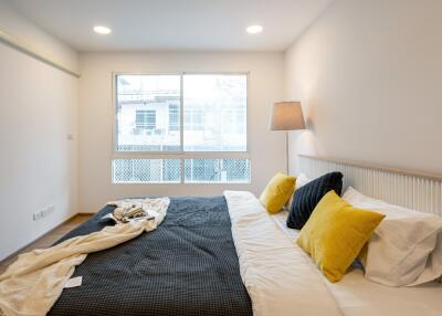 Bedroom with large window and modern décor