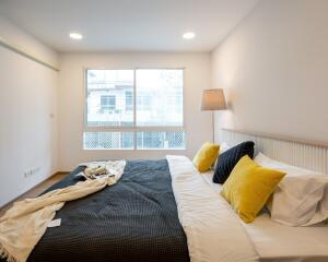 Bedroom with large window and modern décor