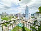 View from the balcony showing cityscape and construction