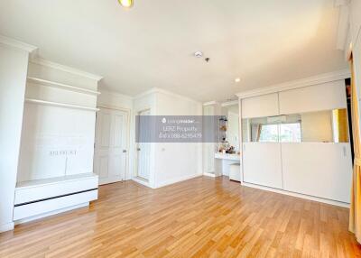 Spacious and bright living room with wooden flooring